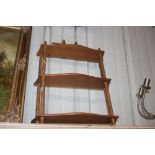 A bamboo effect three tier wall shelf