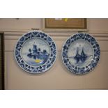 A pair of Delft plates with hand painted decoratio