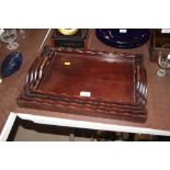 A nest of four hardwood graduating trays