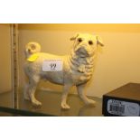 A pottery model dog with glass eyes