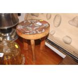 An African wooden stool with beadwork decoration