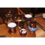 A collection of Victorian copper lustre jugs and m