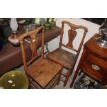 A pair of 19th Century elm seated country chairs