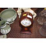 An Edwardian mahogany balloon shaped mantel clock