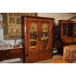 An Edwardian mahogany and satin wood inlaid double