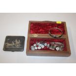 A box containing Eastern silver and Niello decorat