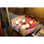 A box of snooker and billiard balls