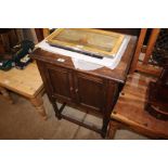 An oak barley twist pot cupboard (locked)