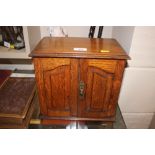 A golden oak smokers cabinet