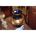 A large blue and gilt decorated baluster vase