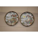 A pair of Noritake plates with figural decoration