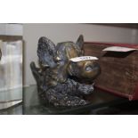 A cast metal desk inkwell in the form of a boars h