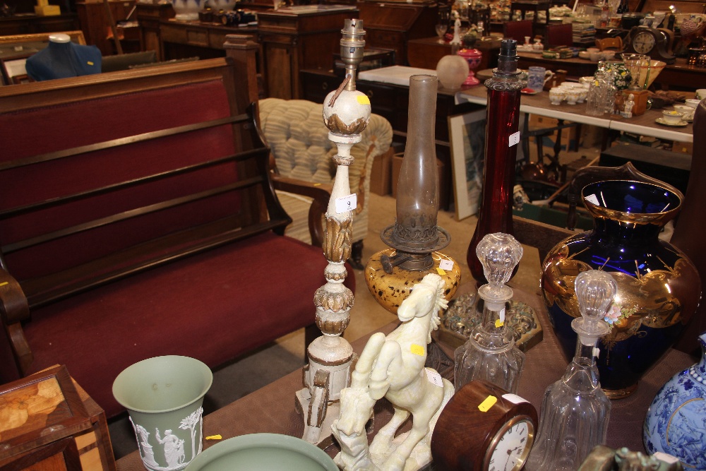 A carved wooden and gilt decorated table lamp base