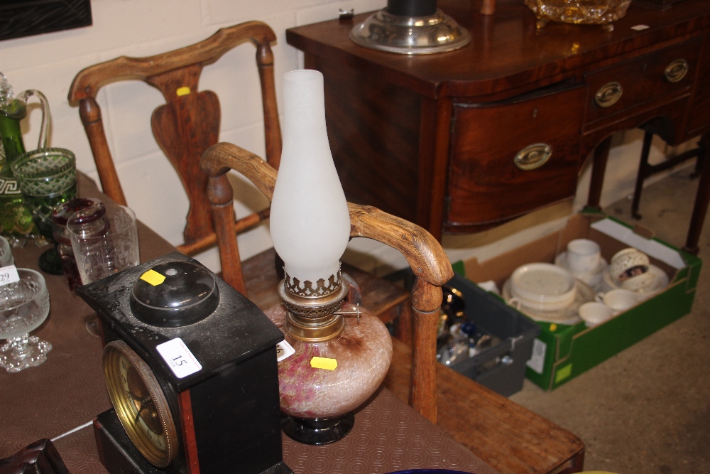 An oil lamp with Art Glass reservoir