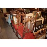 A set of four carved oak and barley twist dining c