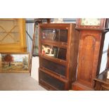 An oak Globe Wernicke style four tier bookcase