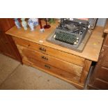 A Danish stripped pine chest fitted three long dra