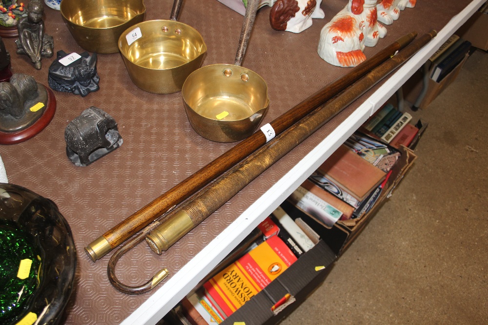 Three various military related walking sticks