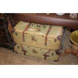 Two canvas and leather bound travelling trunks, on