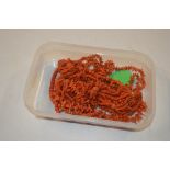 A tray of coral necklaces