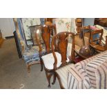 A pair of walnut dining chairs