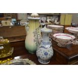 A blue and white pottery vase; and a floral decora