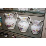 A set of three mid-19th Century floral painted jug