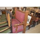 A heavy carved oak and upholstered bench