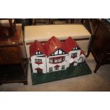 A painted wooden dolls house