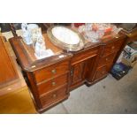 A Victorian mahogany writing desk with brown leath
