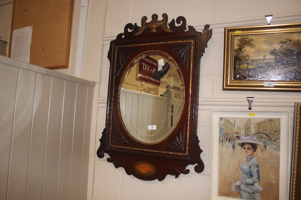 A 19th century mahogany and gilt decorated bevel e