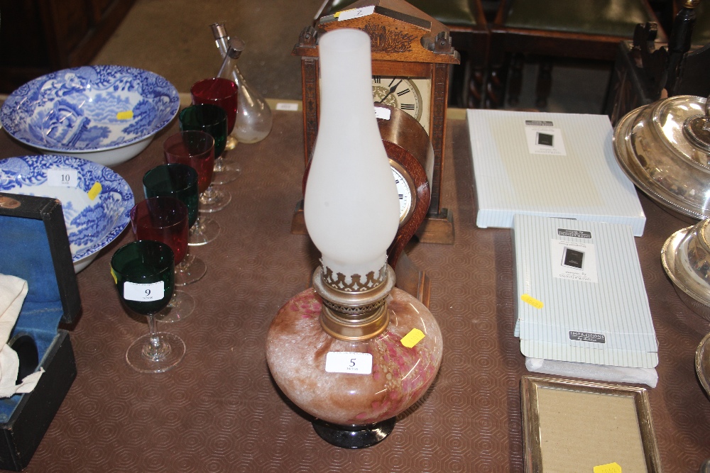 An oil lamp with Art Glass reservoir