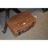 A wicker basket containing novels by Alexandre Dumas