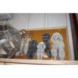 A gilt framed picture of five poodles