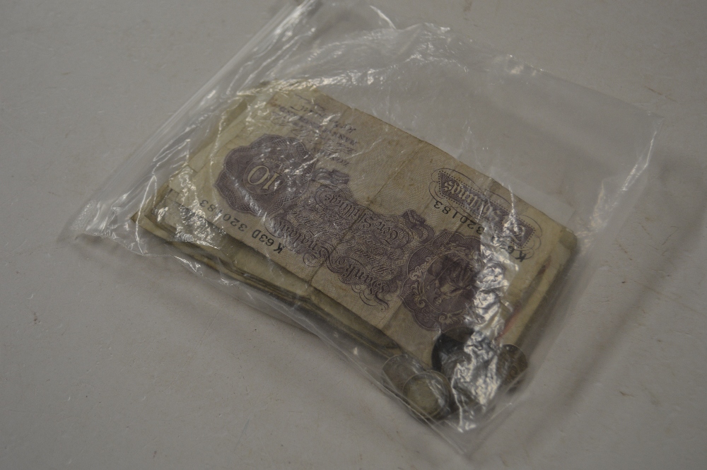 A bag of bank notes and a small quantity of coins