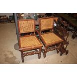 A pair of oak and cane work side chairs