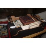 A box containing a post-card album, a photo album,