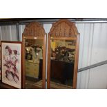 A pair of wooden framed oblong mirrors