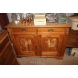 A Danish stripped pine sideboard fitted two drawer