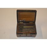 A small rosewood cased music box