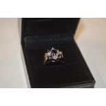 A 9ct gold diamond and sapphire set ring