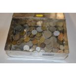 A tin of various coinage