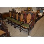 Five oak barley twist and cane back dining chairs,