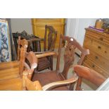 A pair of mahogany Chippendale style carver chairs