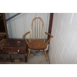 An Ercol elm stick back carver chair