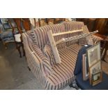 A stripe upholstered two seater settee