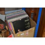 A box of various vinyl records