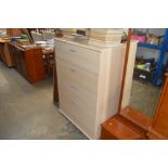 A beech effect five drawer chest