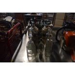 A quantity of various vintage glass bottles