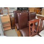 A set of four faux leather upholstered dining chai